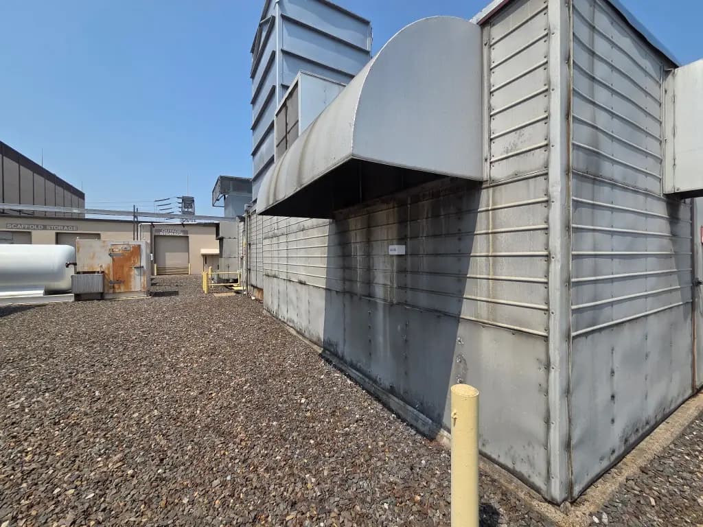 Wider view of the same industrial enclosure with the Talos sensor attached